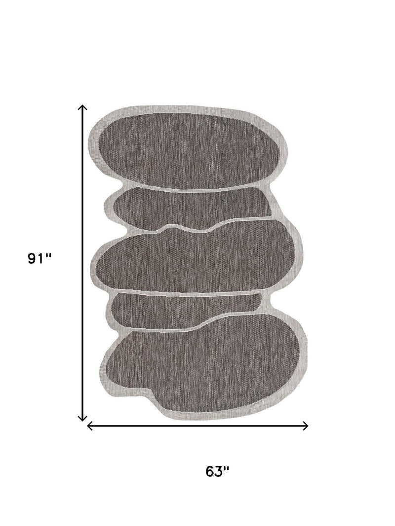Indoor/outdoor area rug with measurements 63 in wide and 91 in long