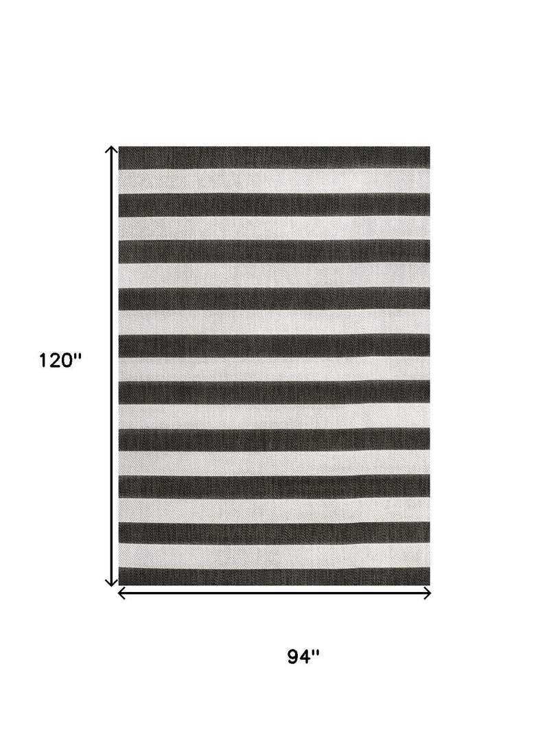 Black and cream striped area rug with 94 in by 120 in dimensions