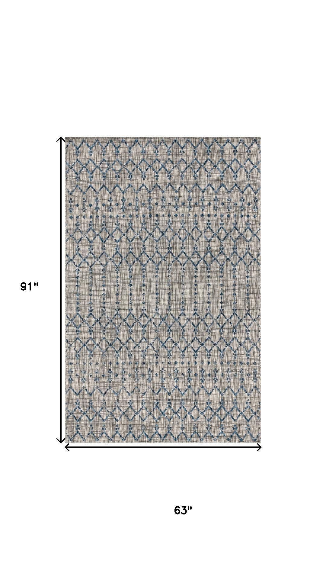 Rectangular light gray rug with navy trellis diamond pattern, 5x8 ft