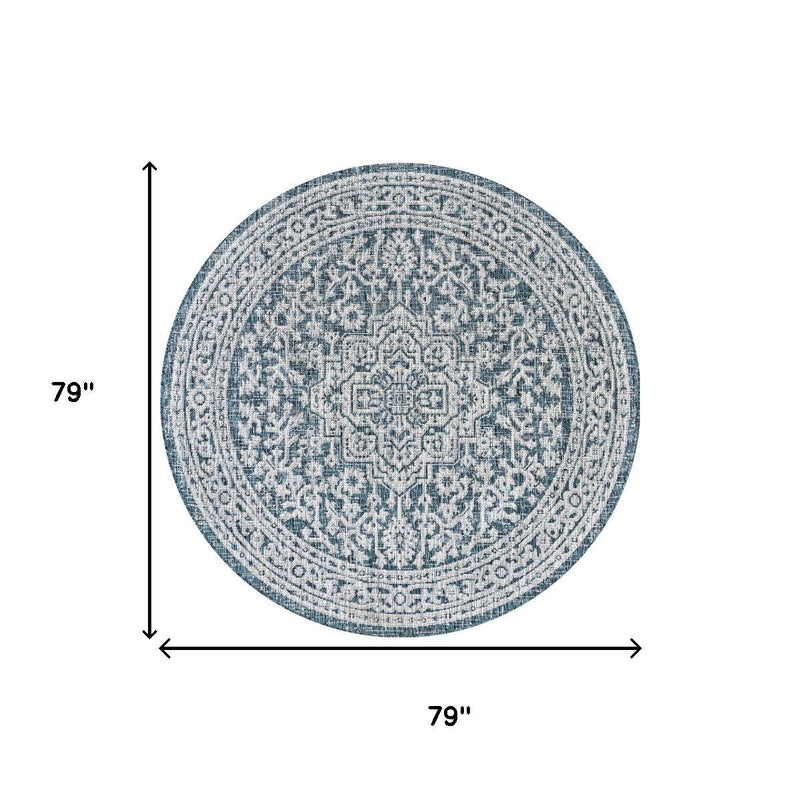 Round area rug medallion design in light blue and gray with teal border, 79 in