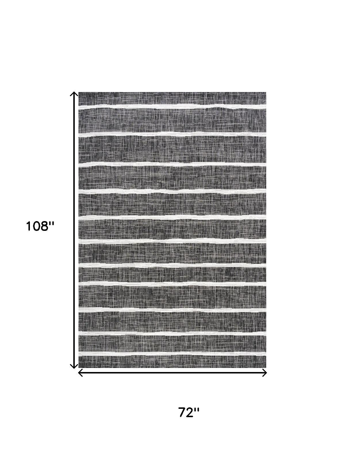Black and ivory striped indoor/outdoor area rug, 6x9 ft.