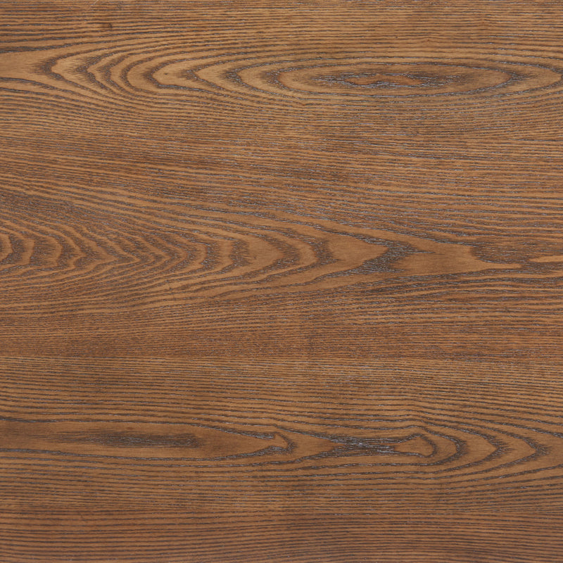 Close-up of brown wood grain on the coffee table surface with visible swirling texture.