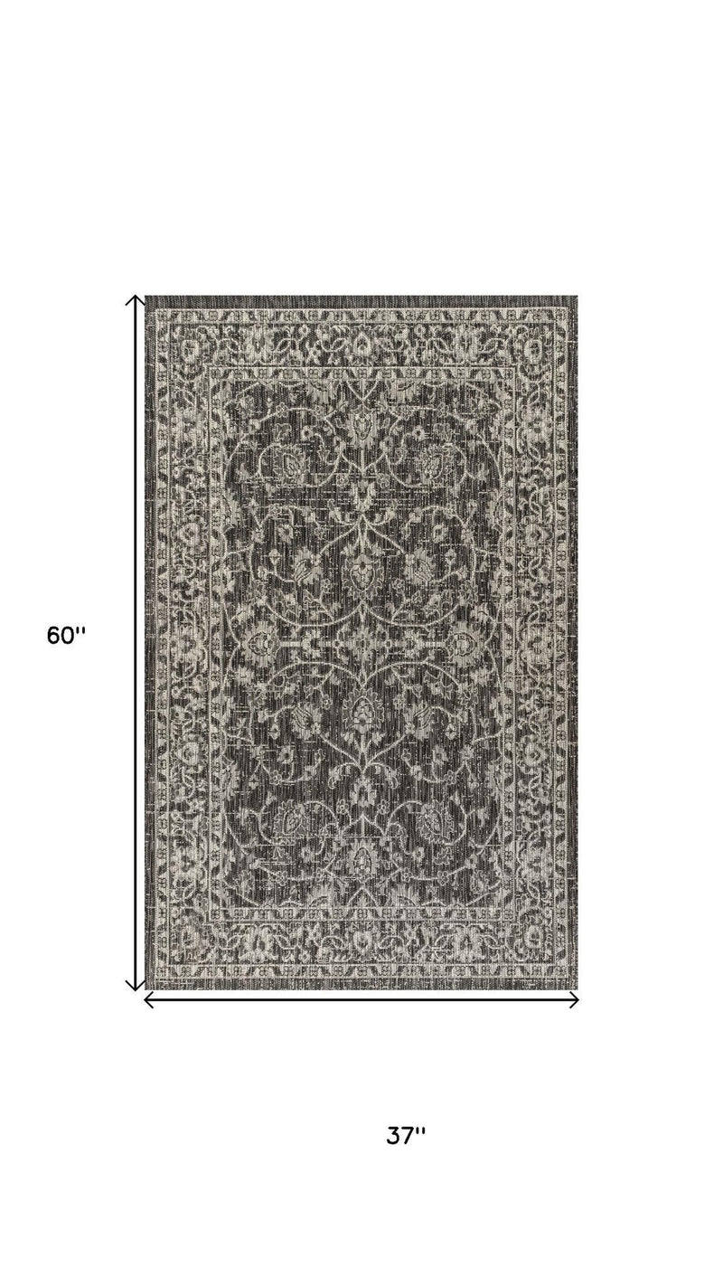 Rectangular gray and black medallion rug; dimensions 60 in and 37 in shown