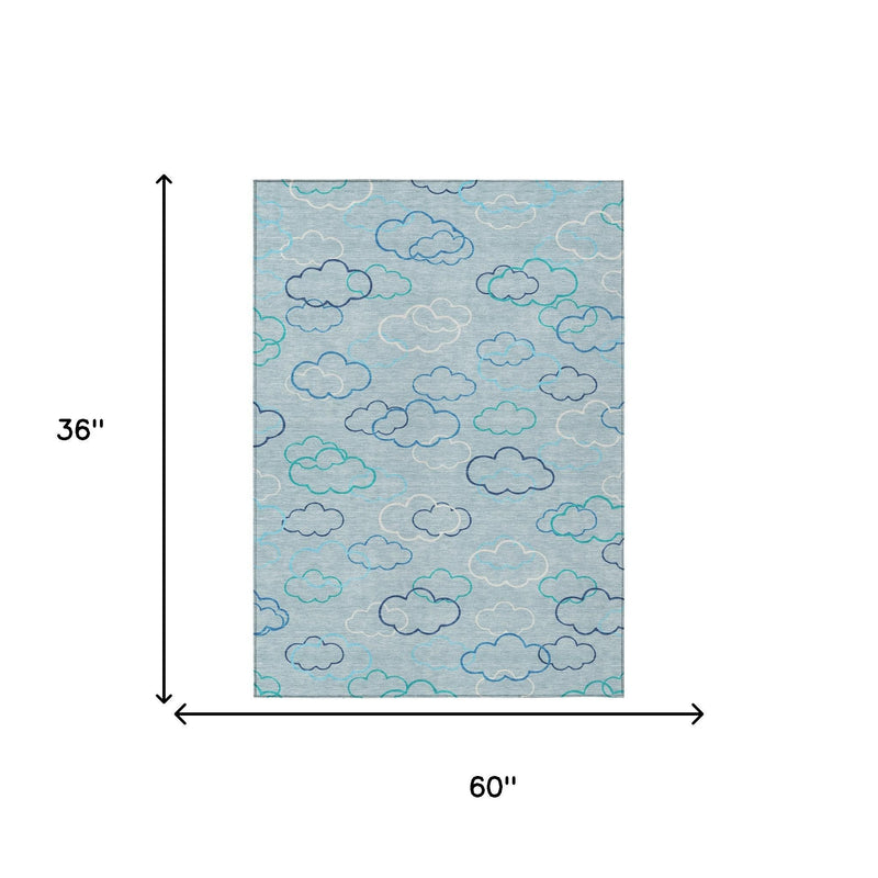 Sky blue area rug with cloud pattern; 60 in x 36 in size