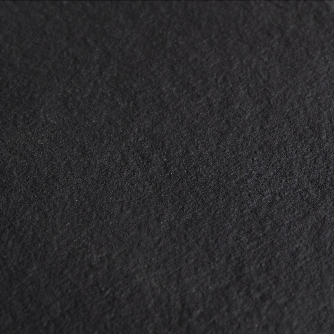 Black slate tray surface detail for clear glass coffee table