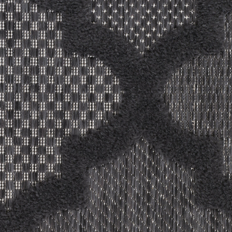 Charcoal runner rug with black-and-ivory trellis pattern and short fringe edge