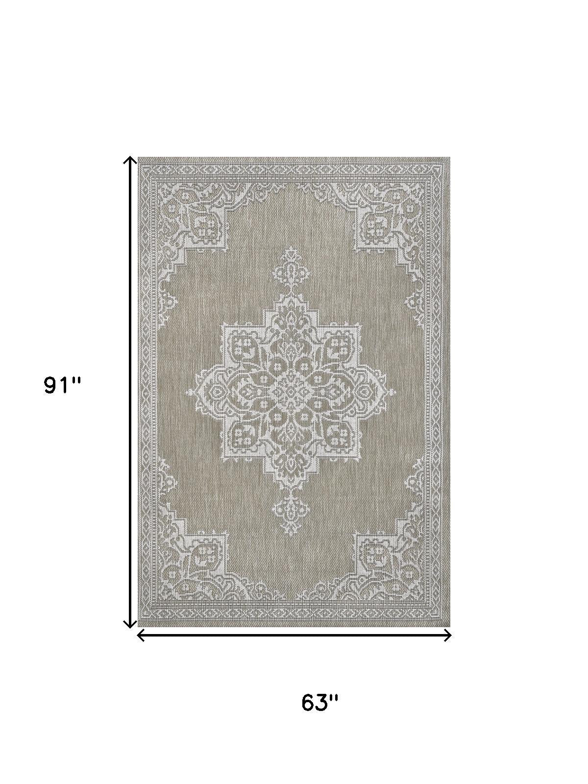 Beige and cream medallion area rug dimensions 63 in by 91 in