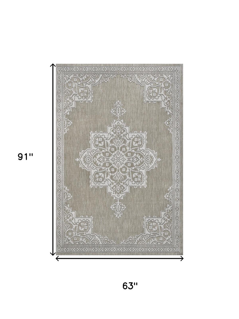 Beige and cream medallion area rug dimensions 63 in by 91 in