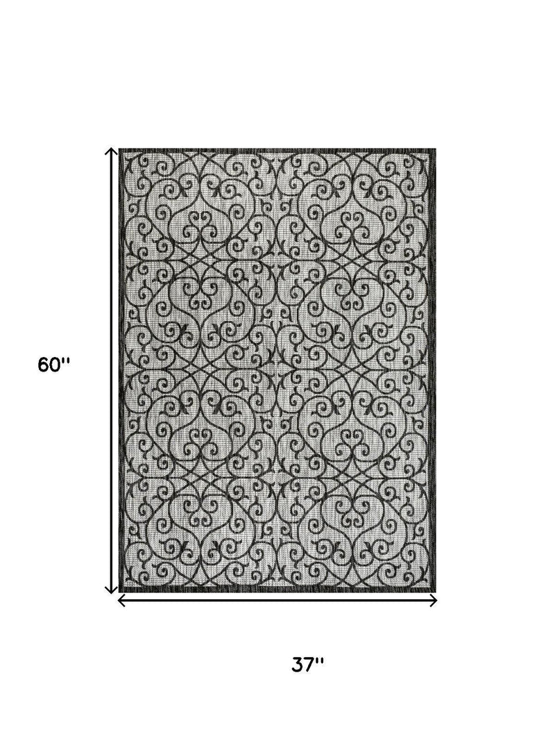 Size diagram for light gray and black geometric area rug, 60 x 37 in