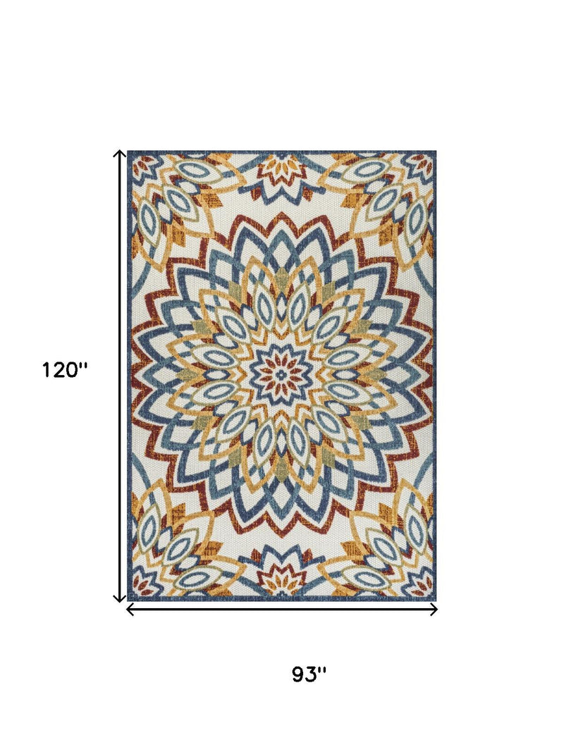 Rectangular medallion area rug with blue, red, and yellow rosette pattern on light cream