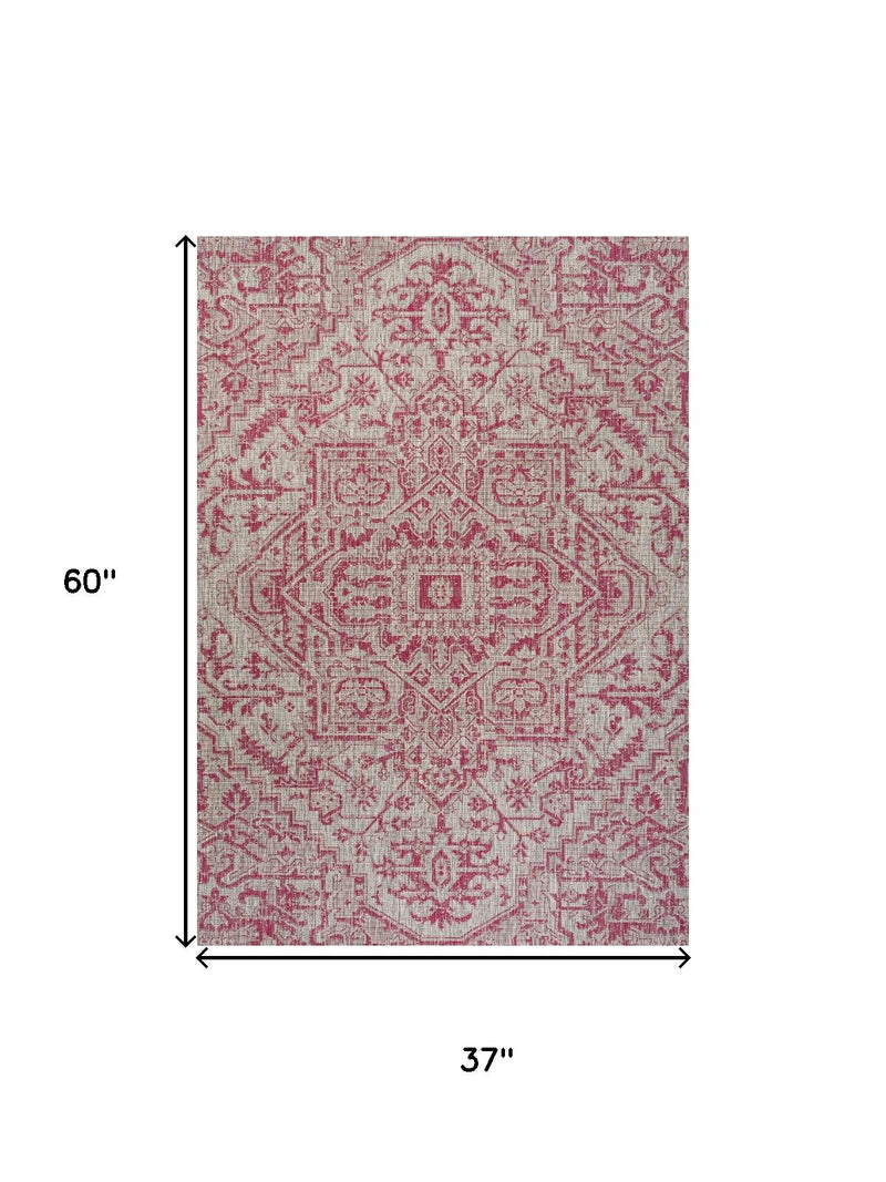 Light gray area rug with fuchsia medallion, 37 in by 60 in size shown