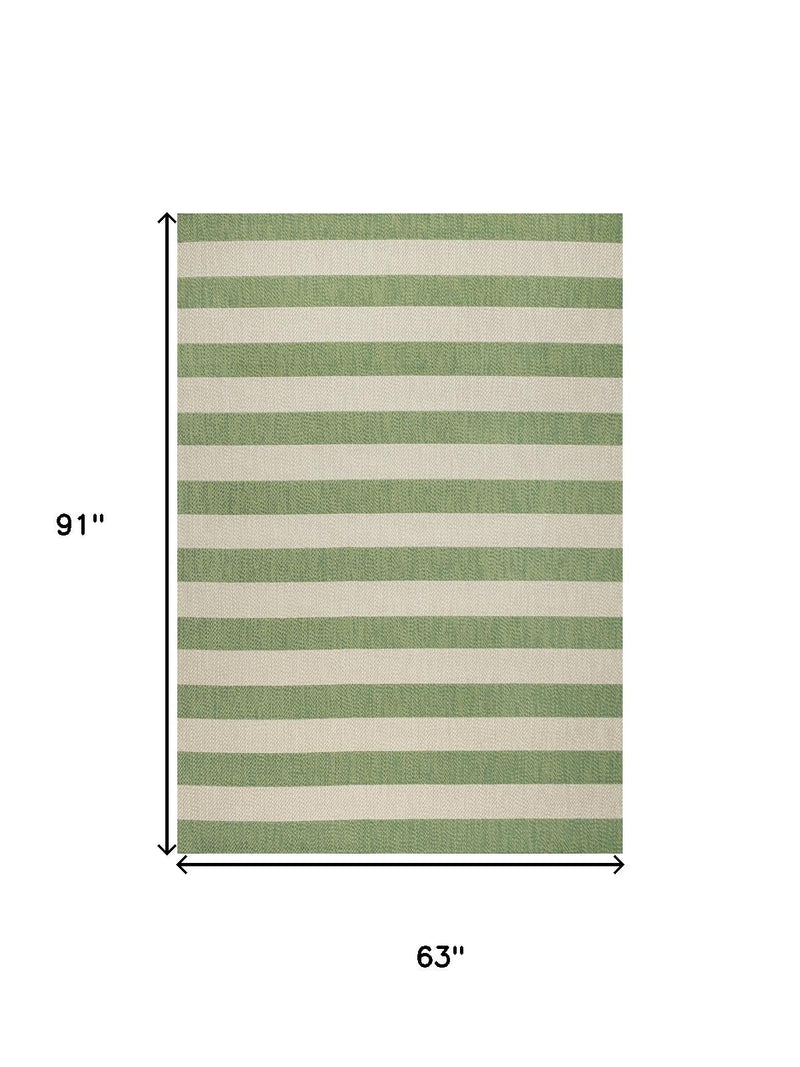 Green and cream striped area rug size 63 x 91 in with horizontal bands