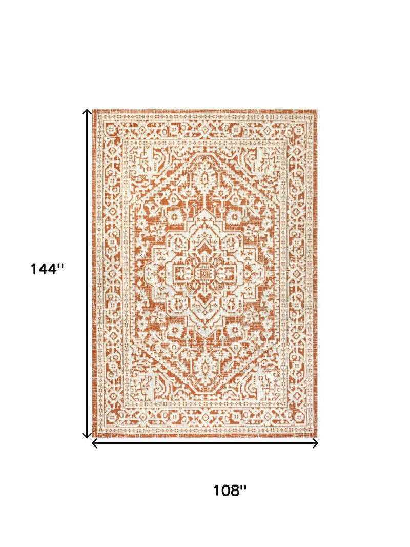 Orange and cream medallion area rug, 9 x 12 ft, measures 108 in by 144 in