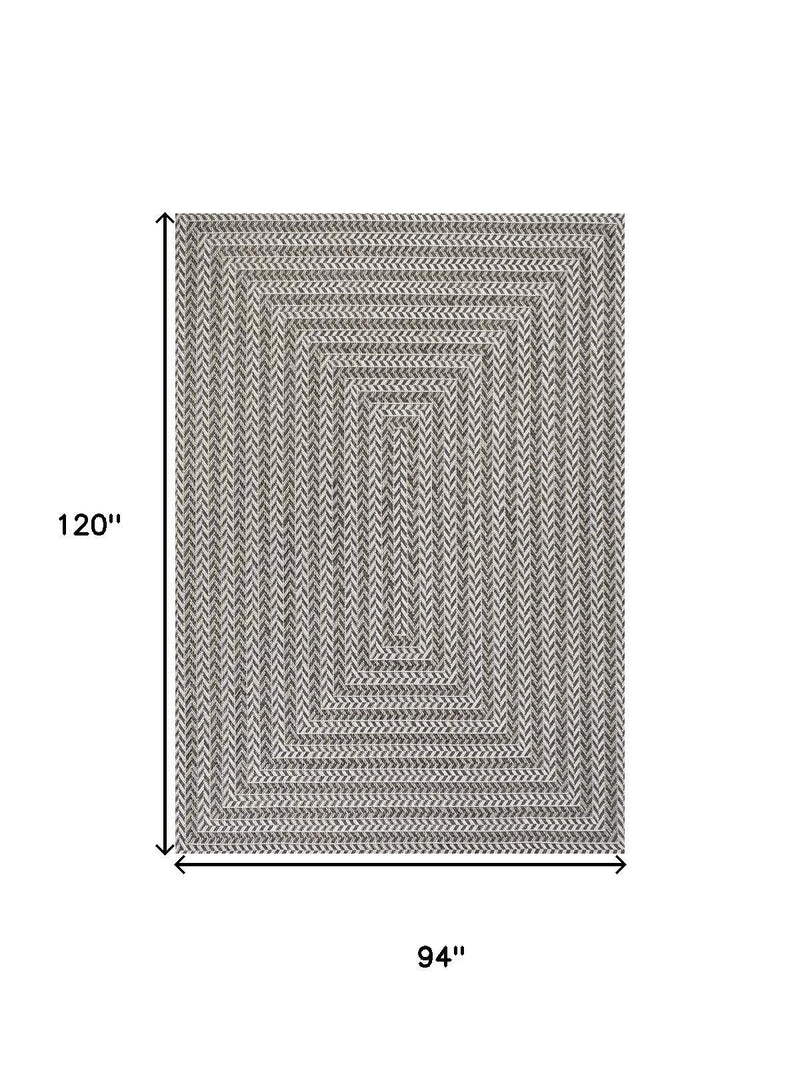 Striped indoor outdoor area rug, dark and light gray zigzag pattern, bordered edges