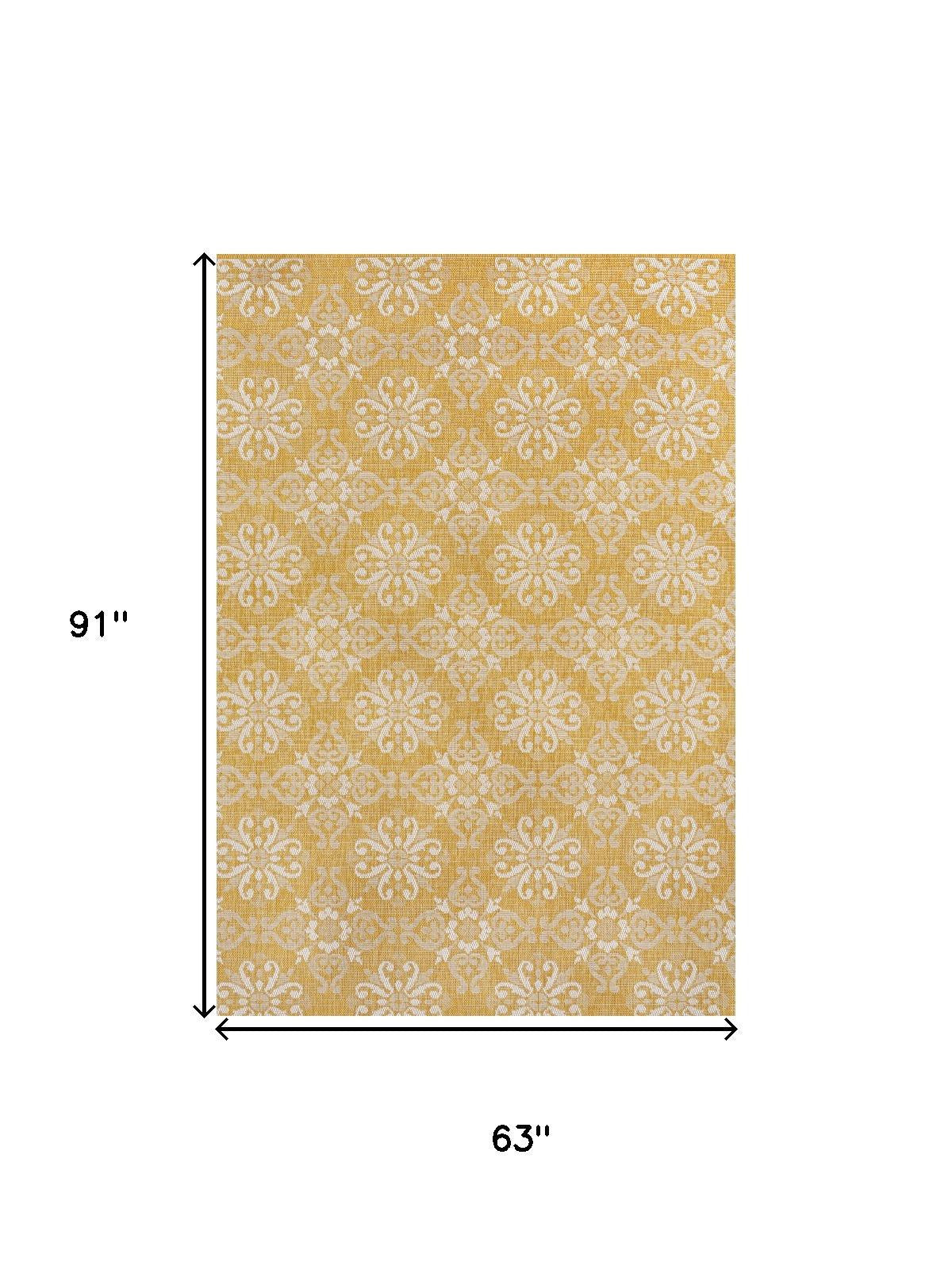 Yellow and cream floral area rug, 63 in x 91 in, damask medallion pattern