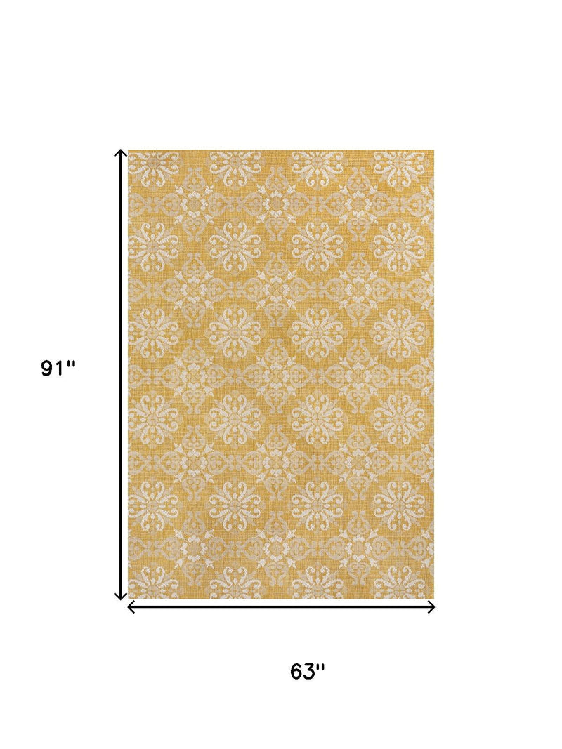 Yellow and cream floral area rug, 63 in x 91 in, damask medallion pattern