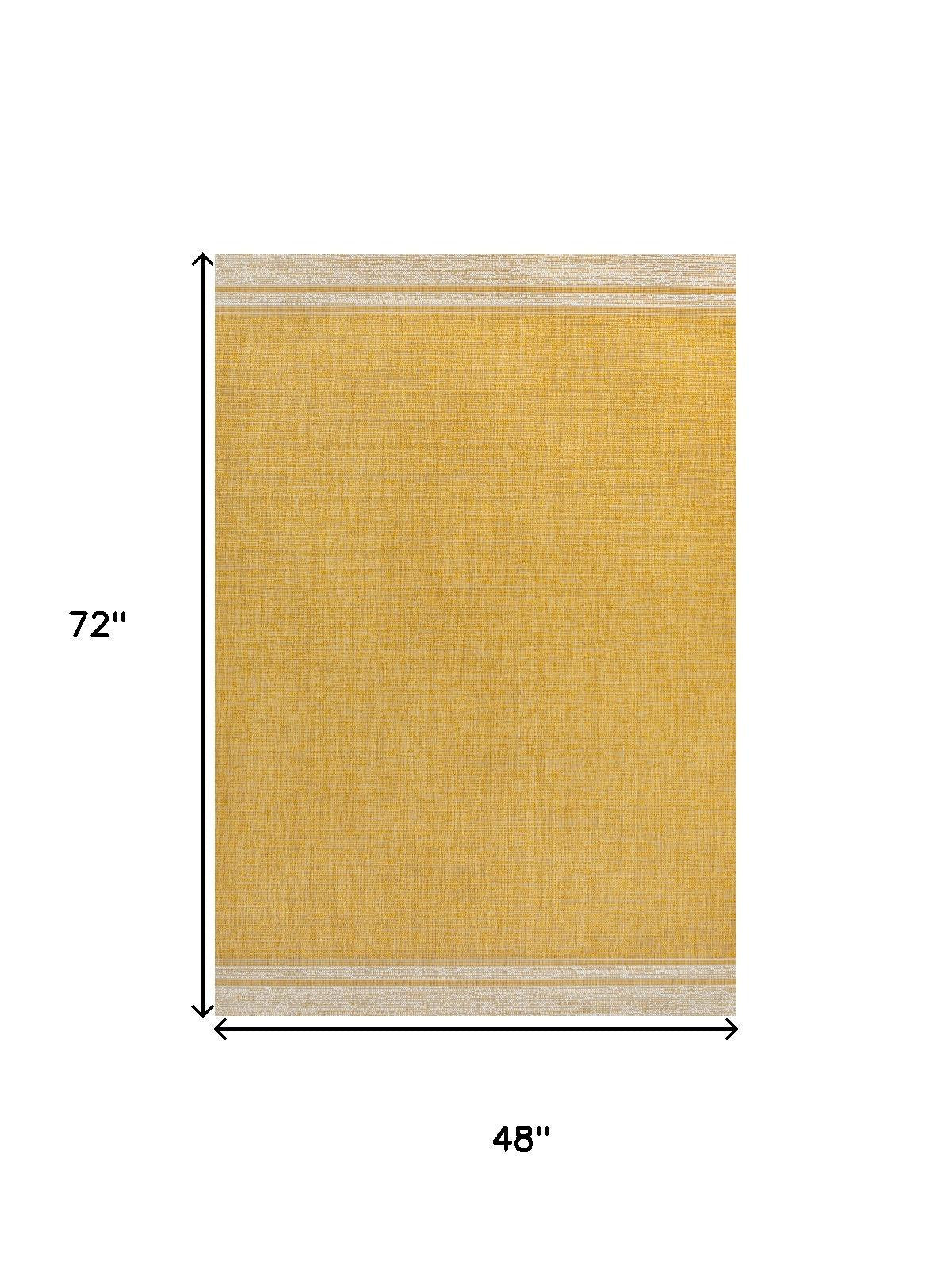 Area rug with yellow center and cream border, flat woven rectangle
