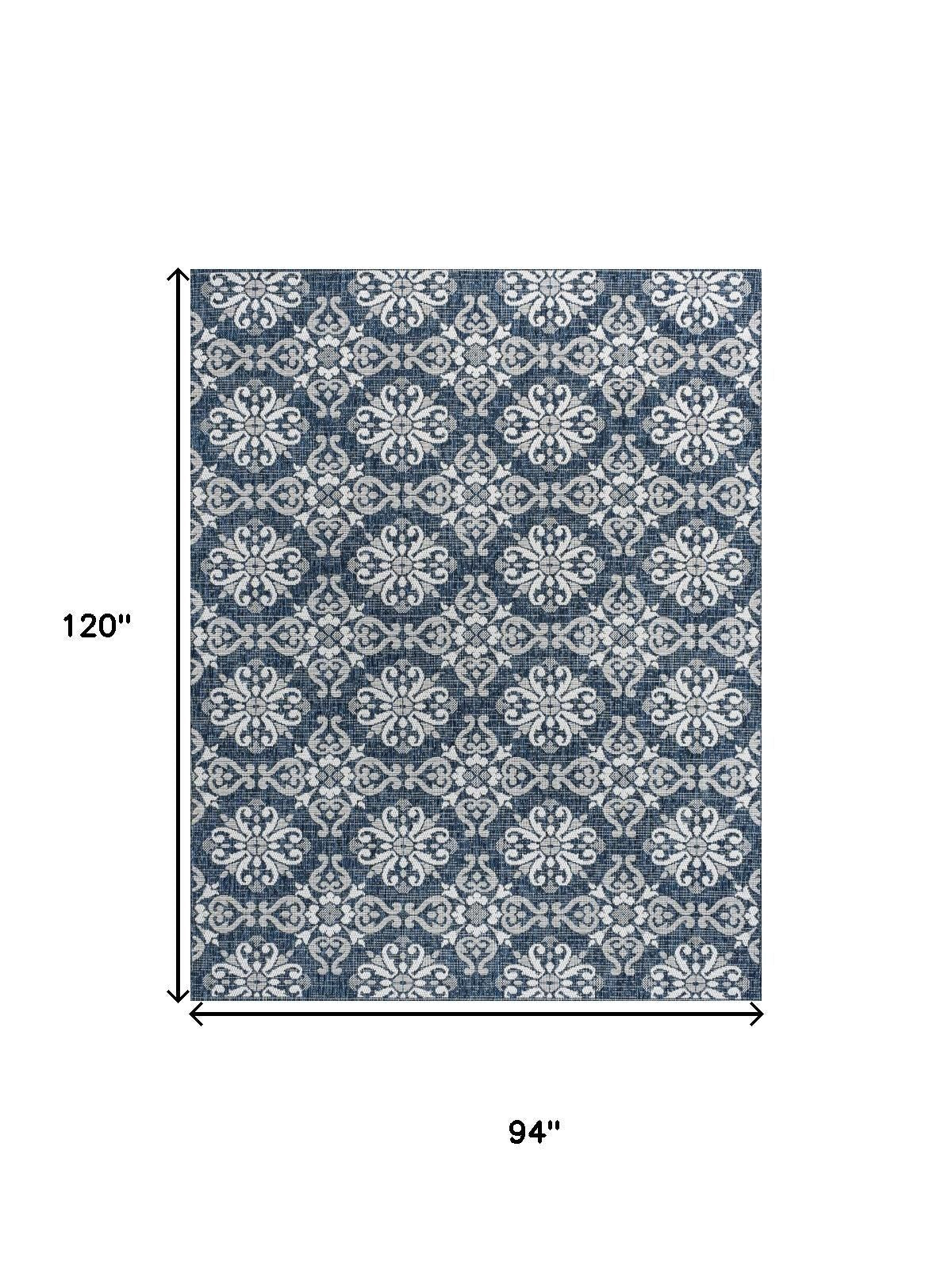 Navy blue and cream floral rectangular indoor/outdoor area rug, 8x10 size.