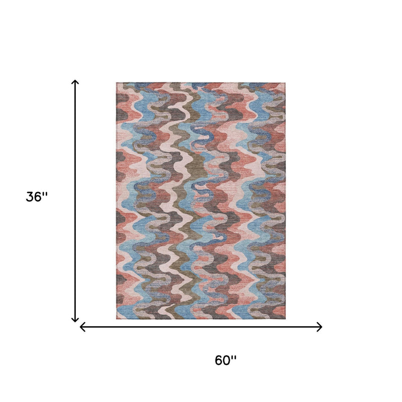 Rectangular multicolor abstract zigzag area rug, 60 in by 36 in, pink coral blue gray.