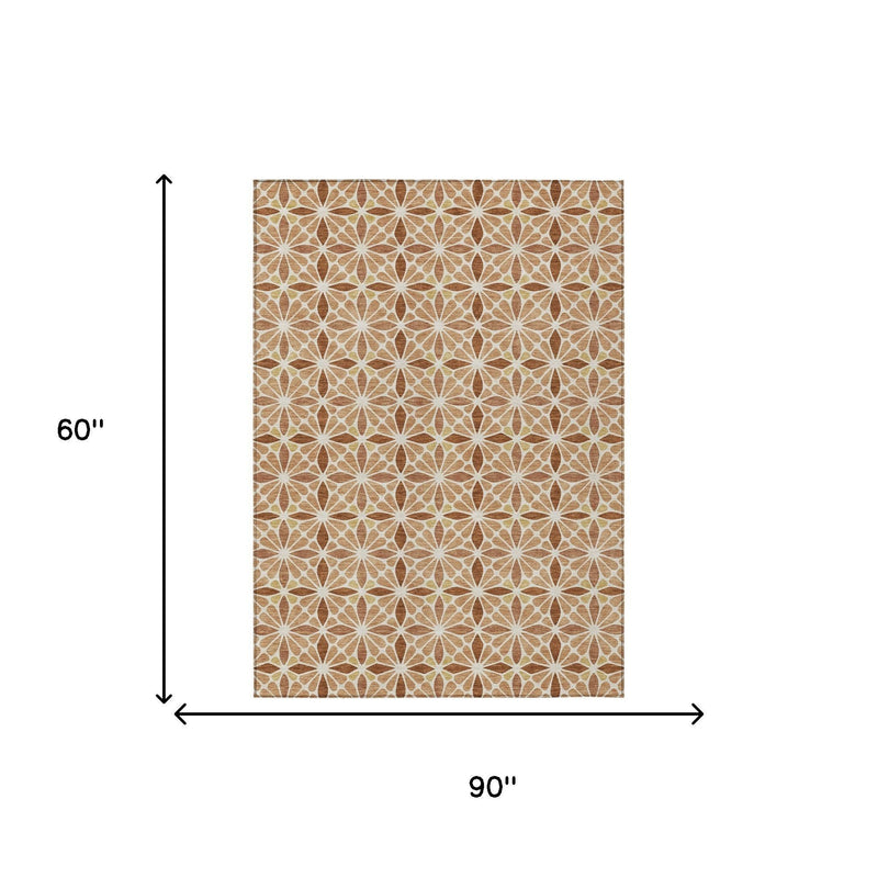 Copper geometric area rug shown with size 90 in by 60 in measurement arrows.