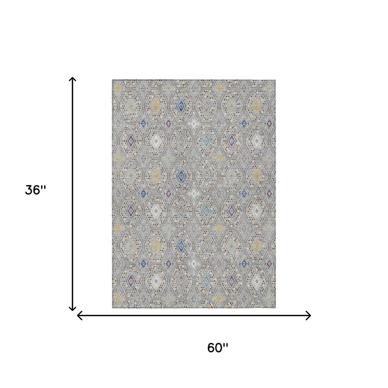 3x5 area rug shown with geometric multicolor hexagon pattern on light gray background