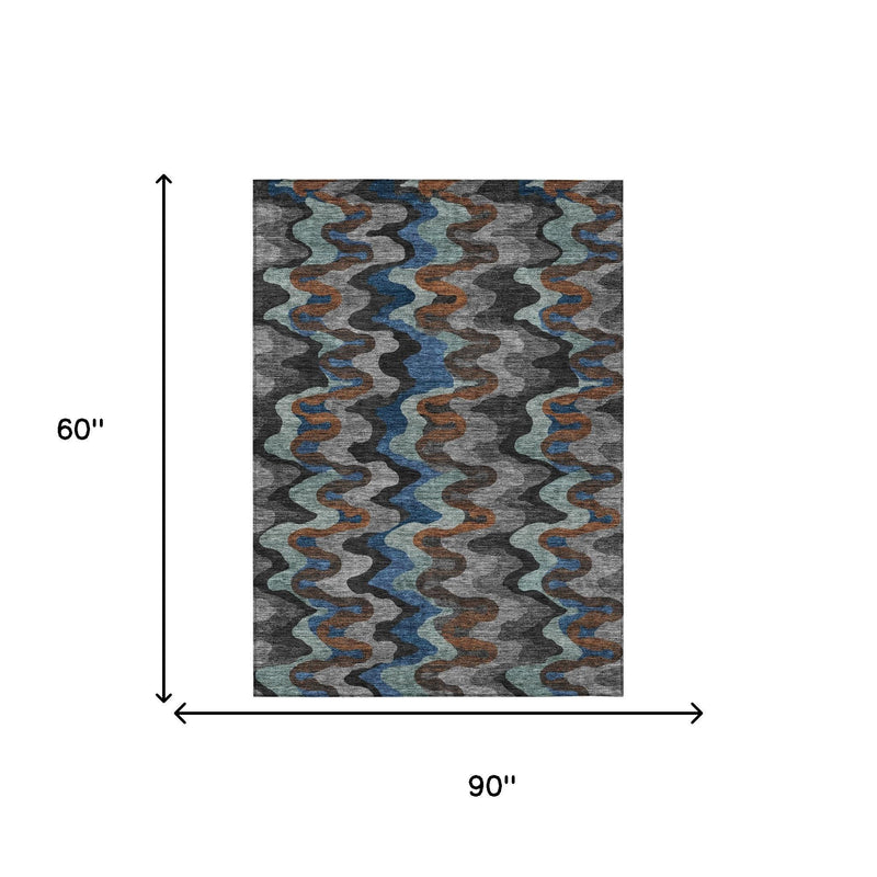 Abstract area rug, 90 in x 60 in, wavy pattern in charcoal gray, blue, and orange