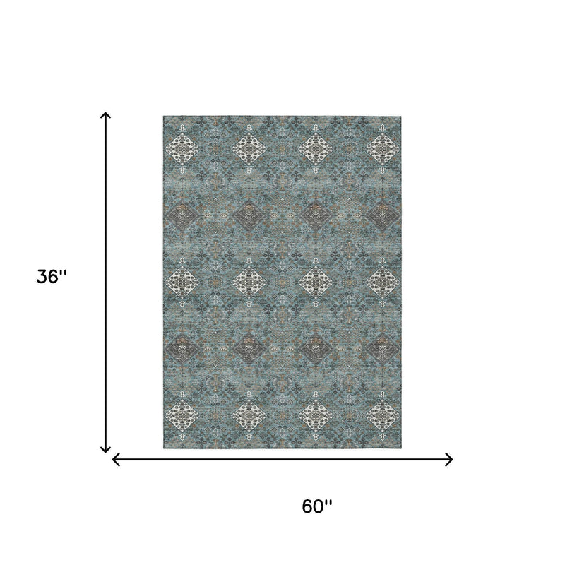 Teal blue and ivory geometric area rug, diamond pattern, size 60 in x 36 in