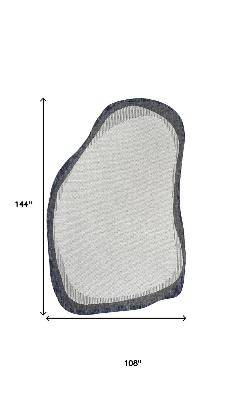 Abstract area rug, cream center with navy trim, 108 in x 144 in