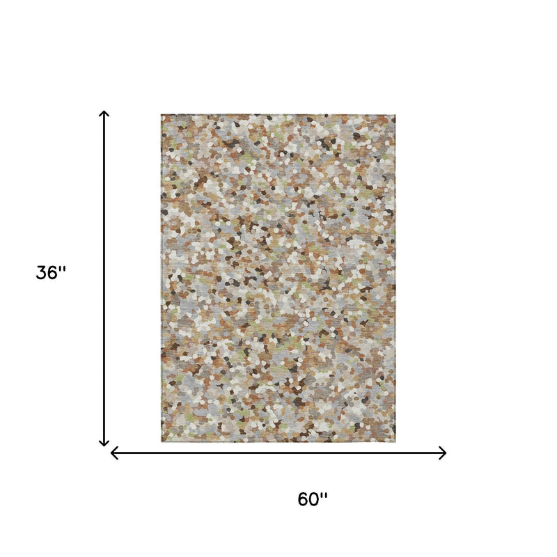 Rectangular geometric area rug with multicolor speckled pattern on light beige ground