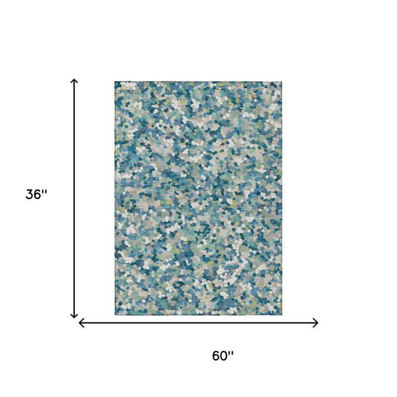 Rectangular teal blue geometric area rug, 60 in by 36 in shown with size arrows