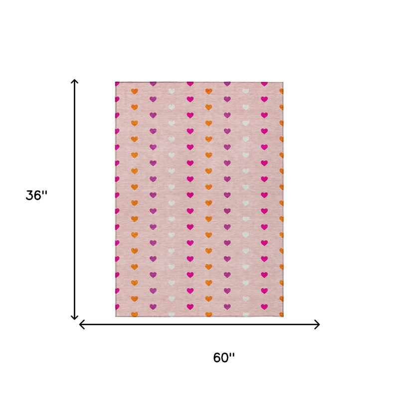 Pink and ivory heart-pattern area rug, 60 in x 36 in size diagram