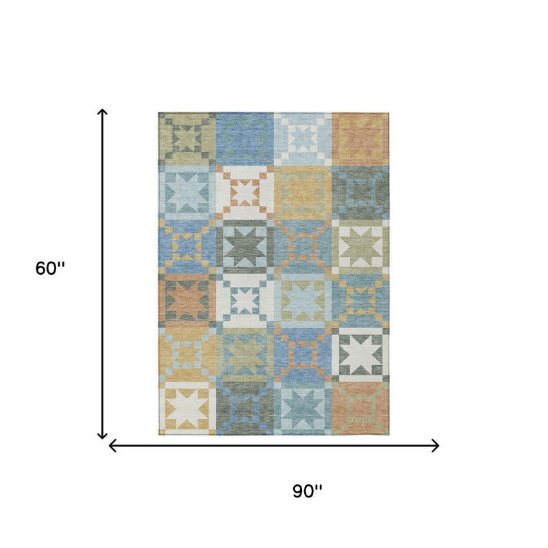 Blue and green patchwork area rug, 90 in x 60 in rectangle with star squares