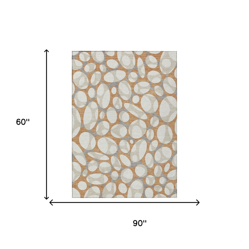 90 in x 60 in abstract area rug with ivory and copper oval pattern on gray ground