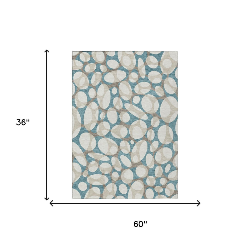Teal and ivory abstract oval area rug showing 60 x 36 in