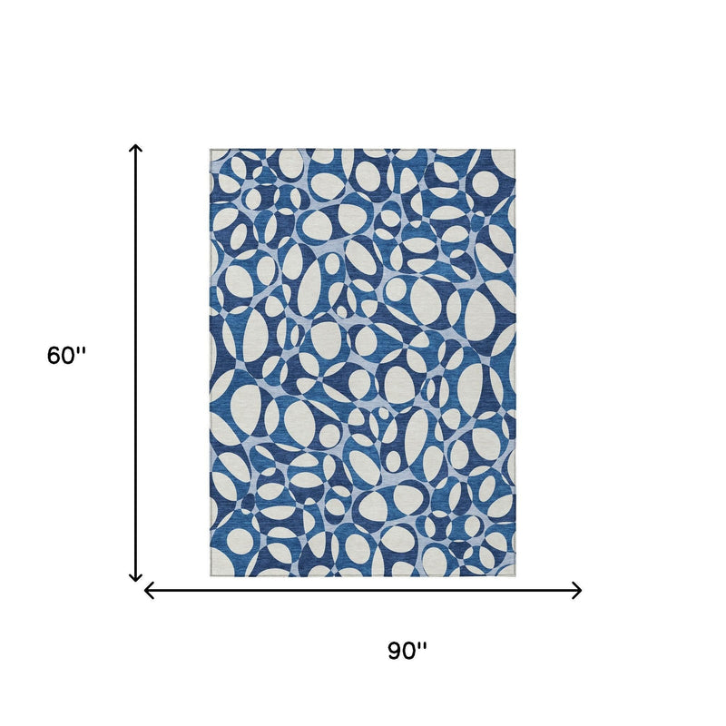 Blue and navy abstract area rug shown with 5 x 8 ft size illustration