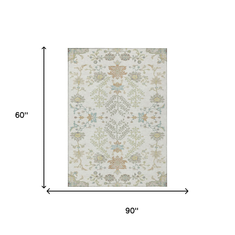Ivory area rug size view with border and centered floral pattern, muted beige and blue
