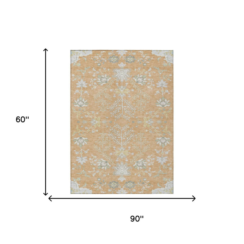 Peach and ivory oriental area rug, 5 ft by 8 ft, with light blue floral pattern