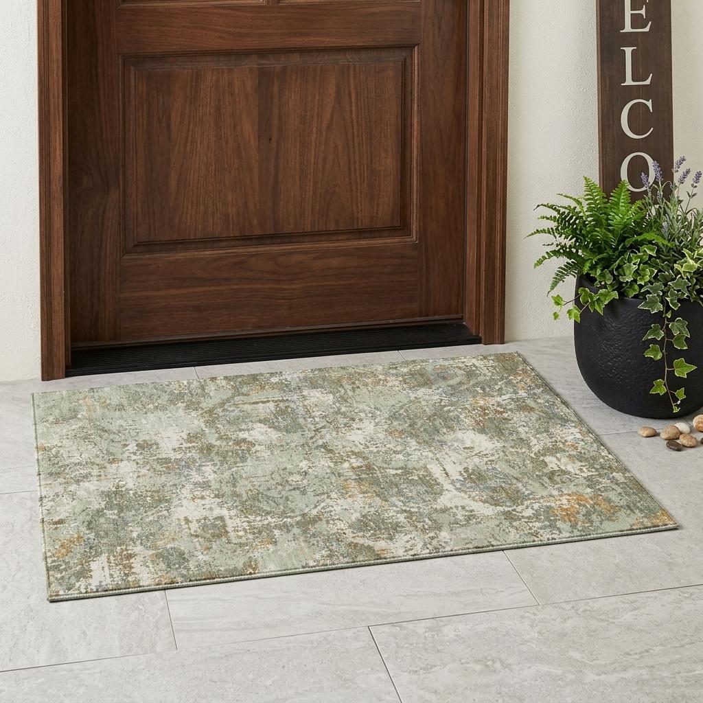 Abstract indoor outdoor area rug in sage green and beige distressed pattern