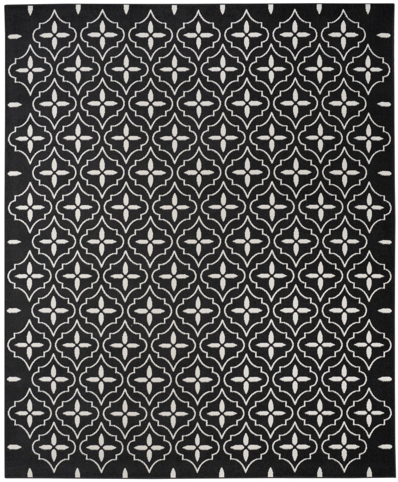 Black rug with evenly spaced ivory geometric quatrefoil pattern, full coverage.