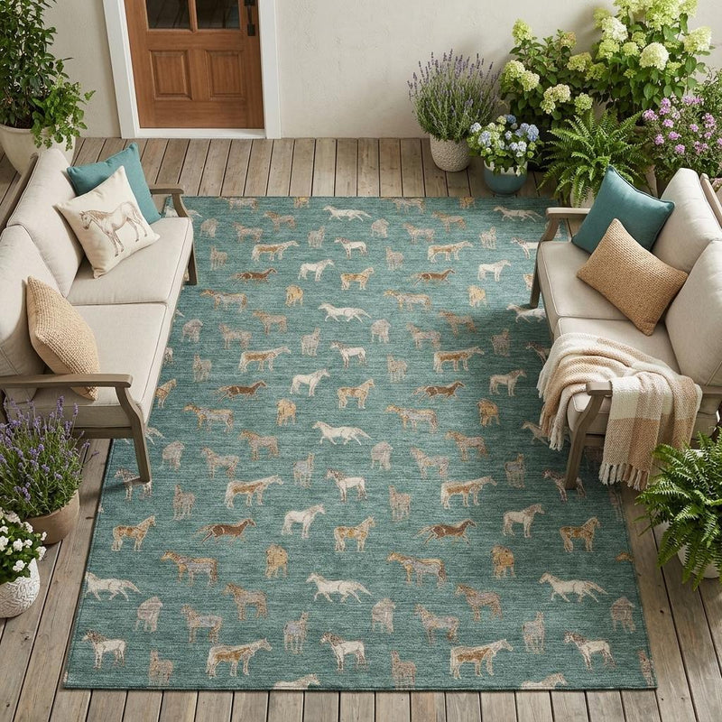 Teal green area rug with beige horse pattern, flat on wooden floor