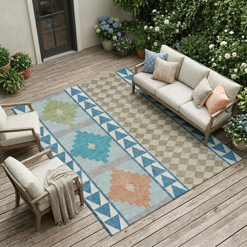 Teal and ivory southwestern area rug on an outdoor wooden deck with geometric border
