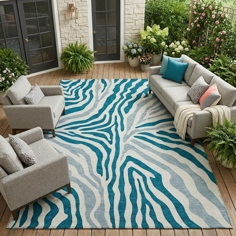Teal blue and ivory zebra print area rug in living room setting