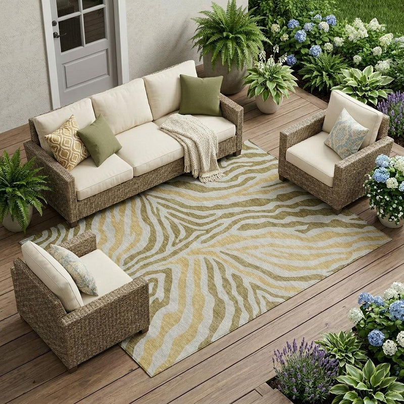Walnut-and-gold zebra print area rug under outdoor seating, flat woven.