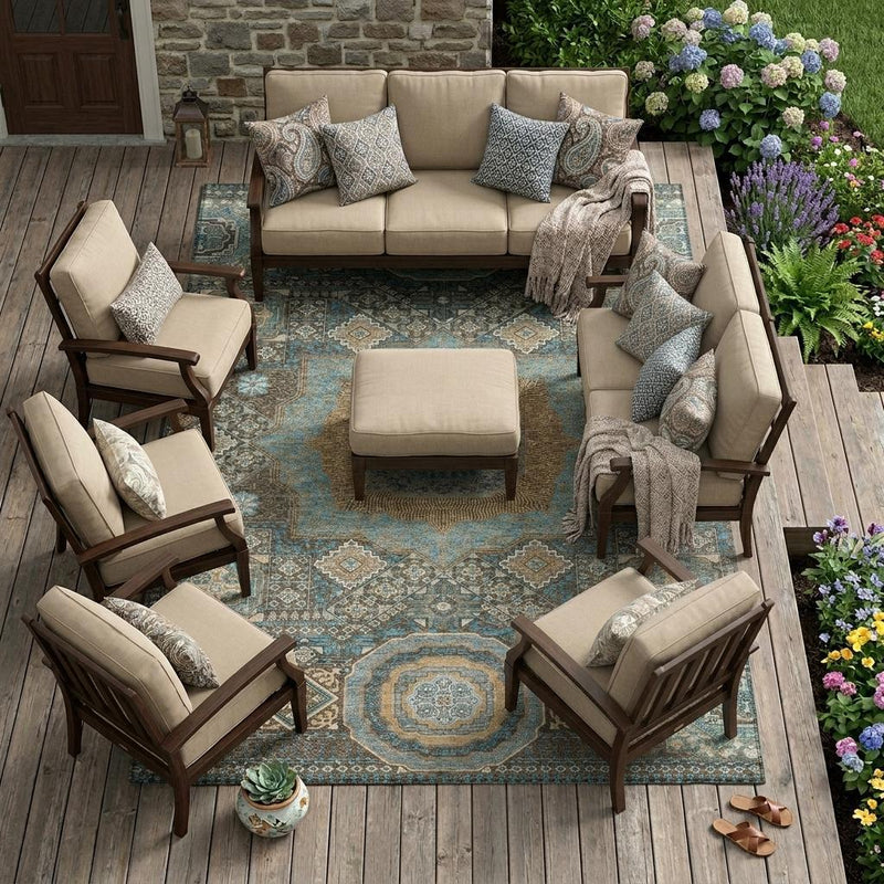 Indoor outdoor seating area rug with blue, beige, and brown oriental pattern and medallions
