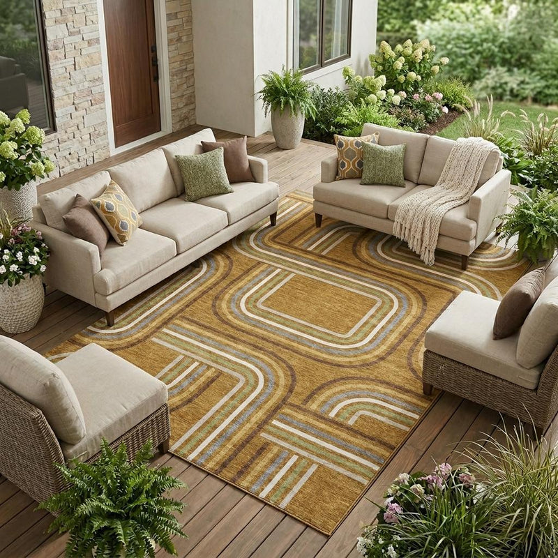 Geometric indoor/outdoor area rug on wood deck with gold-brown and white/green stripe pattern