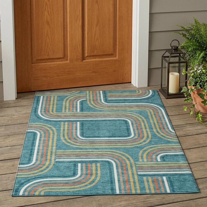Teal blue geometric area rug with ivory and tan outlined wave lines
