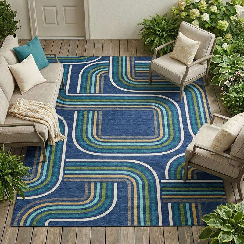 Geometric area rug in navy blue with aqua and gold curved line pattern