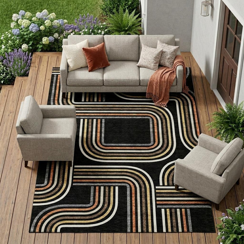 Black geometric area rug with ivory and warm-toned stacked wave design