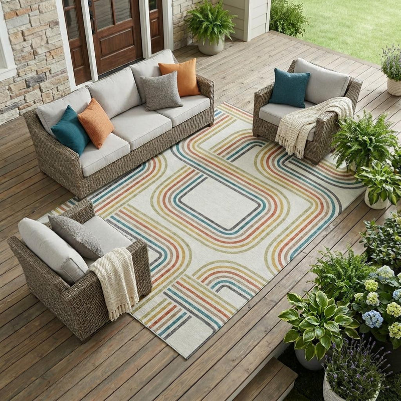 Outdoor area rug on wooden deck with ivory base and multicolor geometric square pattern
