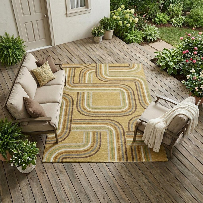 Indoor outdoor area rug with gold and ivory geometric wave pattern and green accents